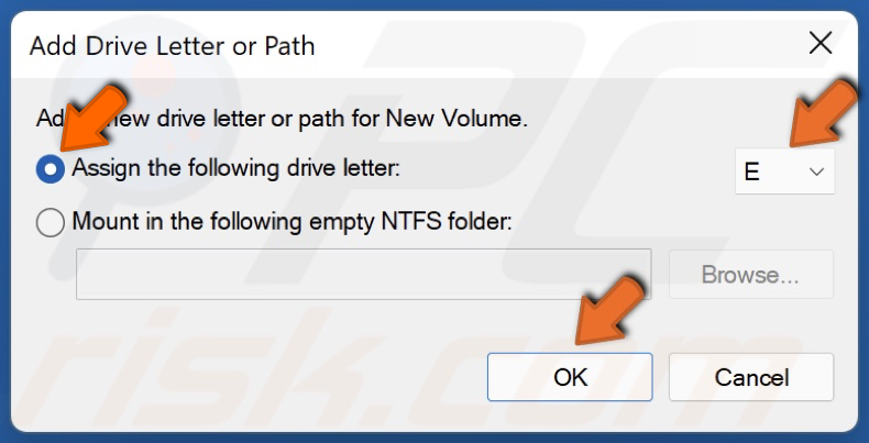 Tick Assign the following drive letter and select the letter you want and click OK